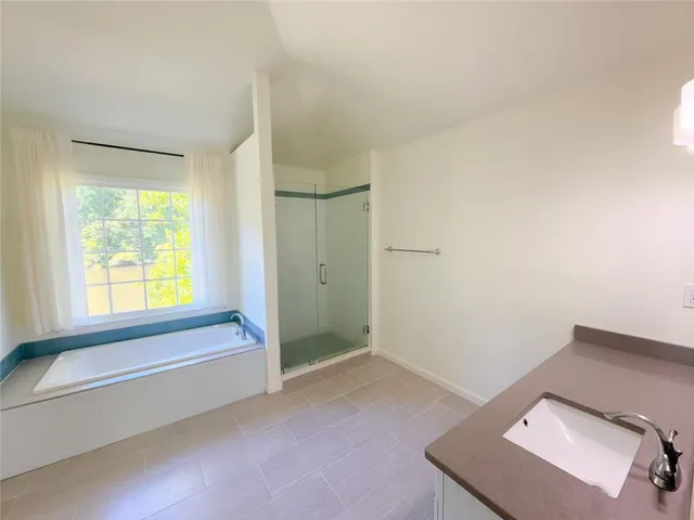 a view of room with window and tub
