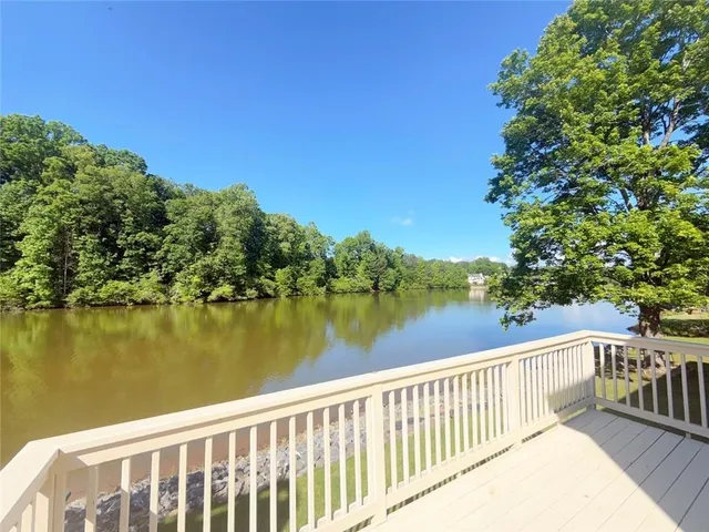 a balcony with trees in front of it