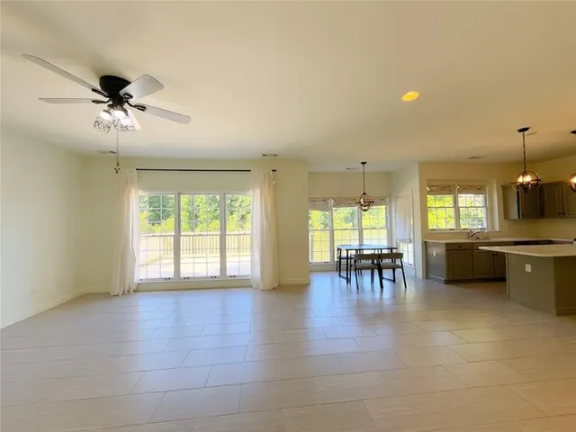 a view of a livingroom with furniture and a window