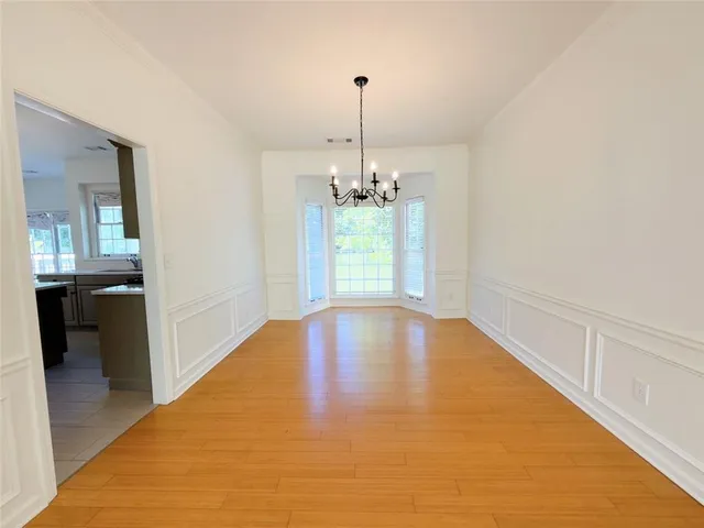 a view of an empty room with glass door