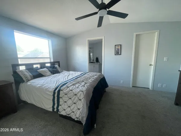 a kitchen with stainless steel appliances granite countertop a sink a stove a refrigerator cabinets and furniture