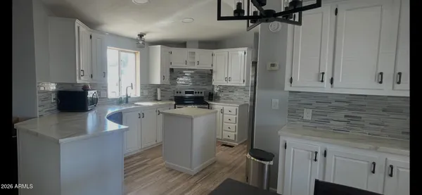 a spacious bathroom with a bathtub and a sink