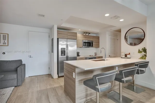 a kitchen with a table and chairs