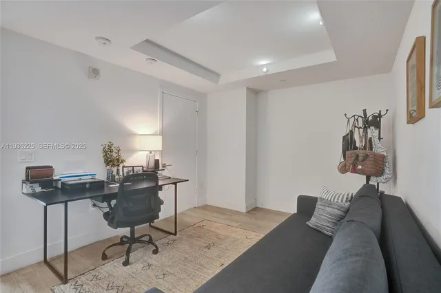 a view of a workspace with furniture