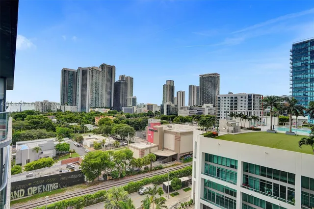 a view of a city with tall buildings