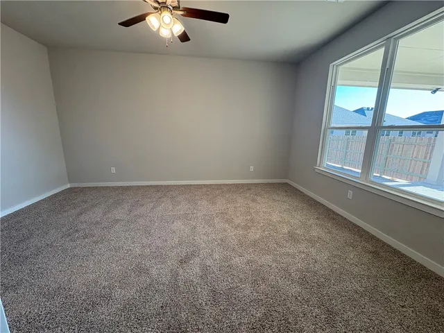 a spacious bathroom with a granite countertop sink a mirror and shower