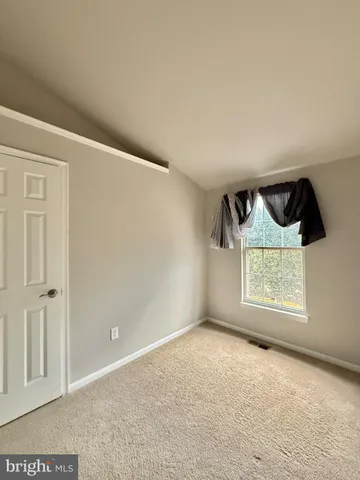 a bathroom with a sink toilet vanity and shower