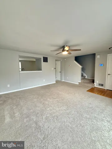 a view of a livingroom with a staircase