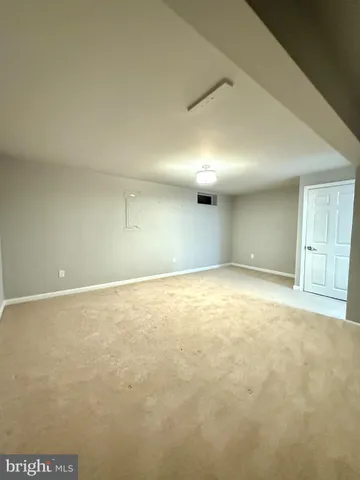 an empty room with an empty space and windows