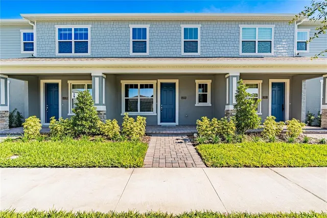 a front view of the house with garden