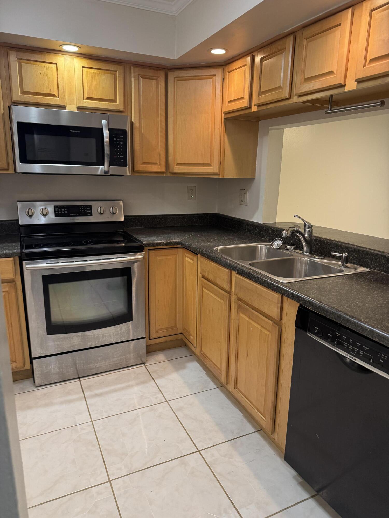 a kitchen with a sink and a microwave