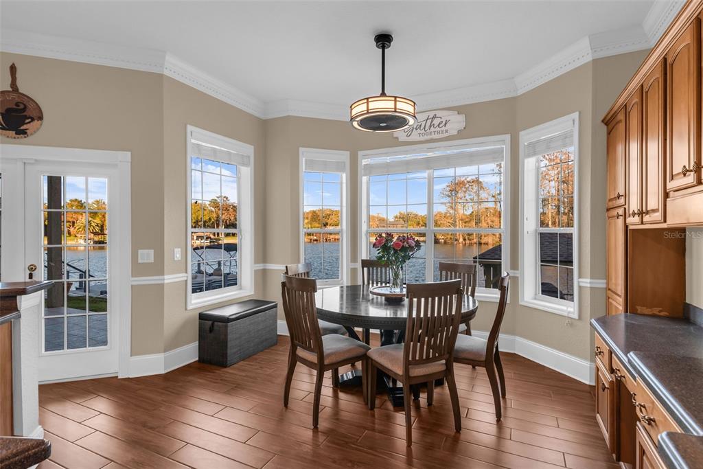 1425 Riviera Drive Kissimmee, FL 34744 - Photo 18 of 82 a view of a dining room with furniture window and wooden floor