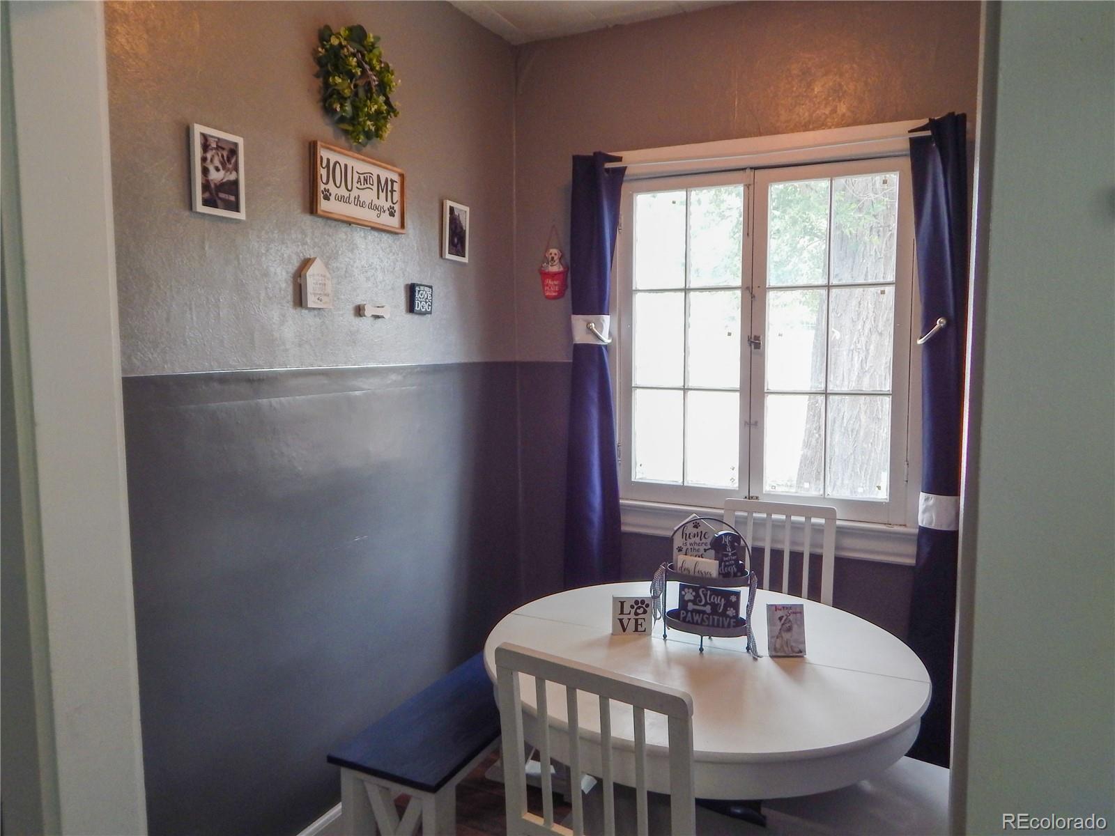 910 South Main Street Lamar, CO 81052 - Photo 11 of 37 a view of a dining room with furniture and window