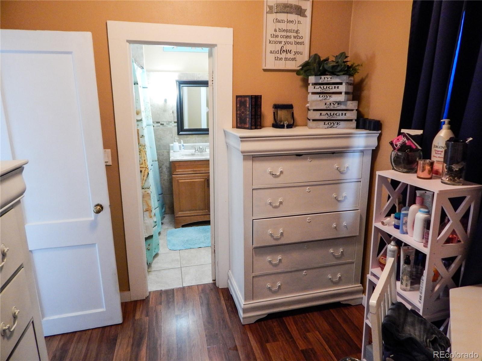910 South Main Street Lamar, CO 81052 - Photo 15 of 37 a view of walk in closet with clothes and shoes