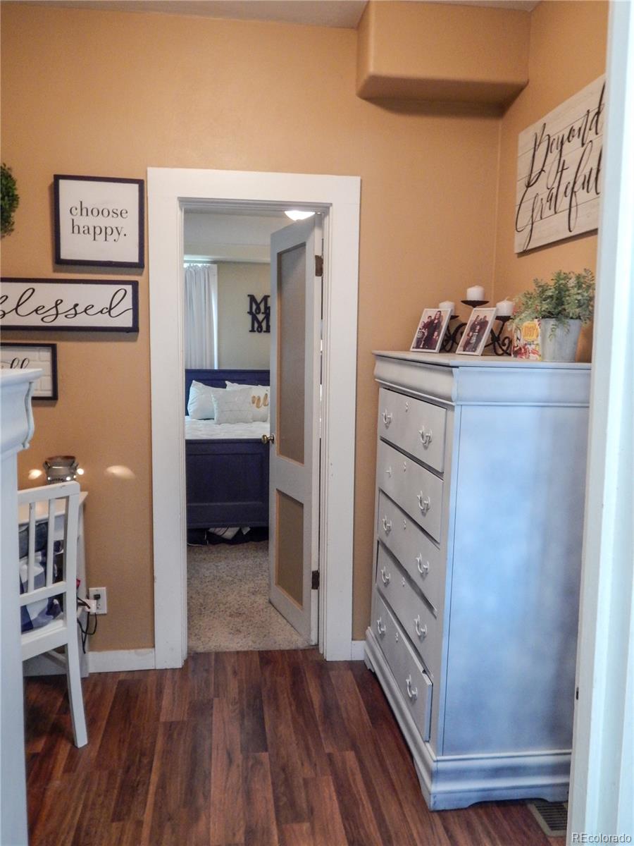 910 South Main Street Lamar, CO 81052 - Photo 18 of 37 a view of bedroom with wooden floor