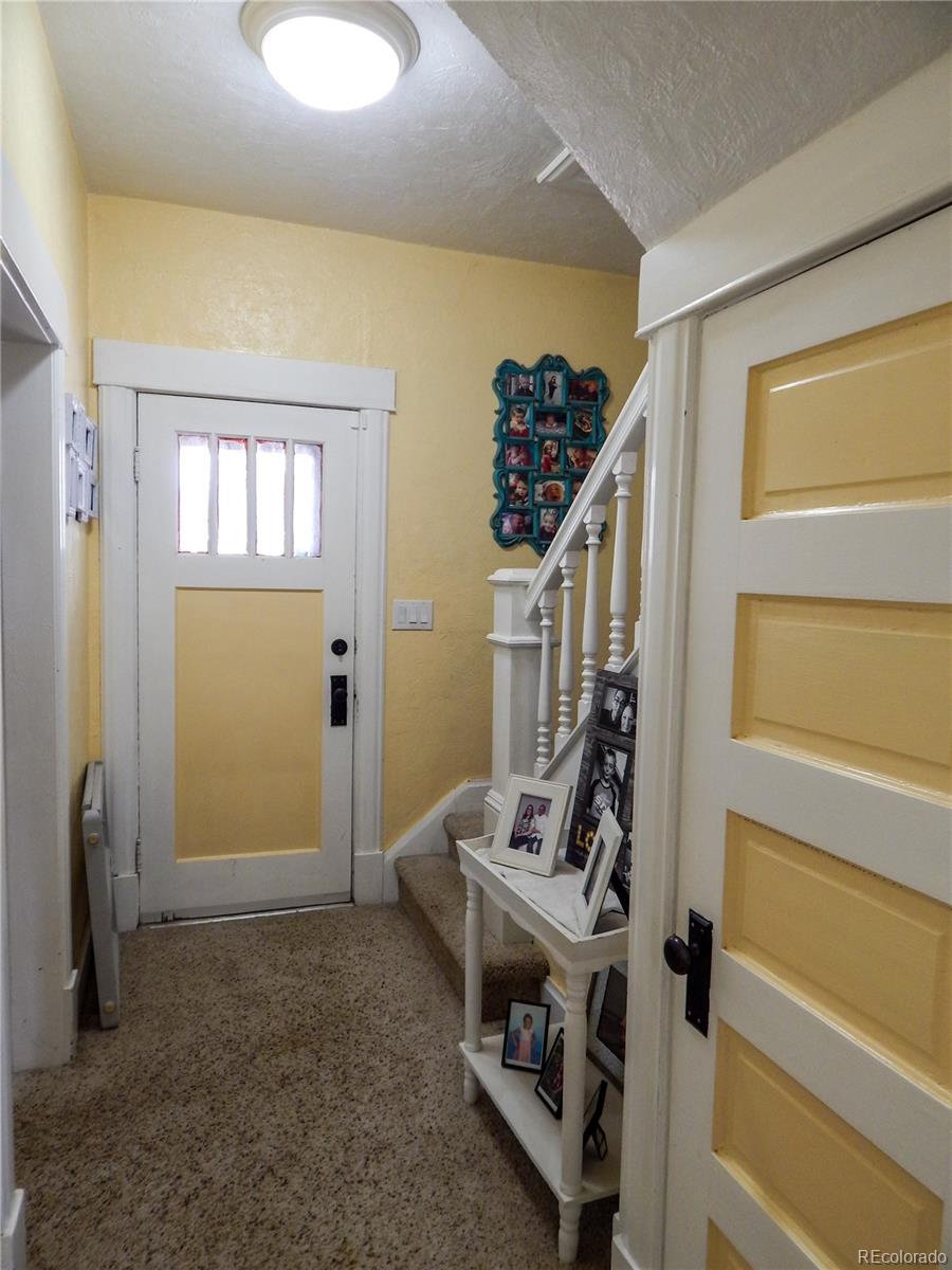 910 South Main Street Lamar, CO 81052 - Photo 3 of 37 a view of a livingroom with furniture and stairs