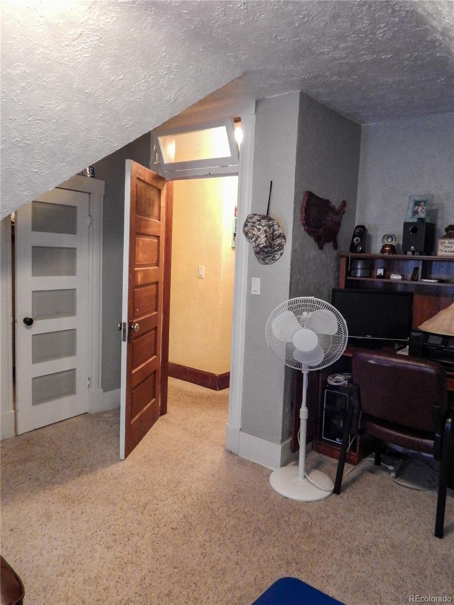 910 South Main Street Lamar, CO 81052 - Photo 31 of 37 a view of workspace with furniture and windows