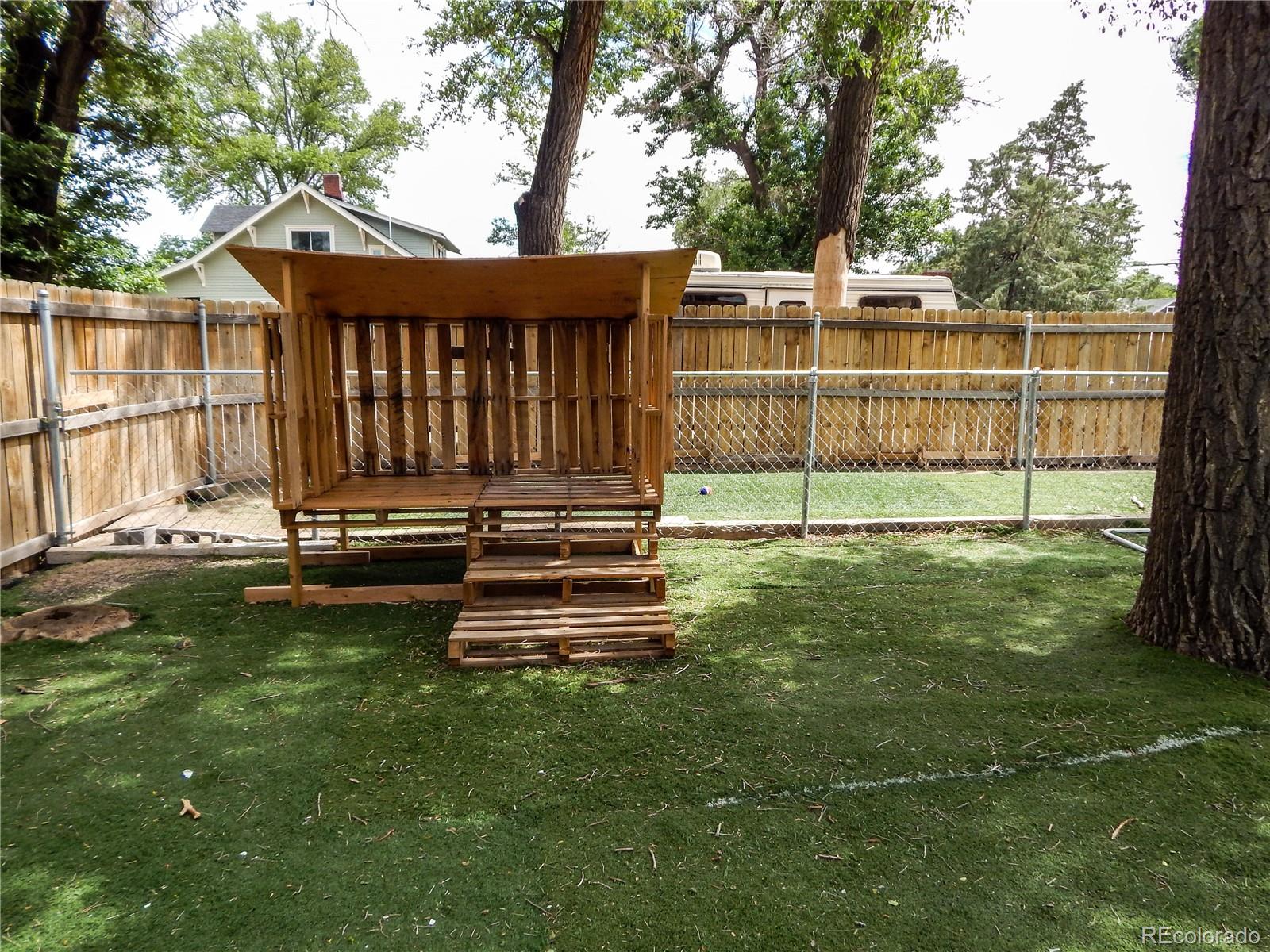 910 South Main Street Lamar, CO 81052 - Photo 36 of 37 a view of a deck with a yard