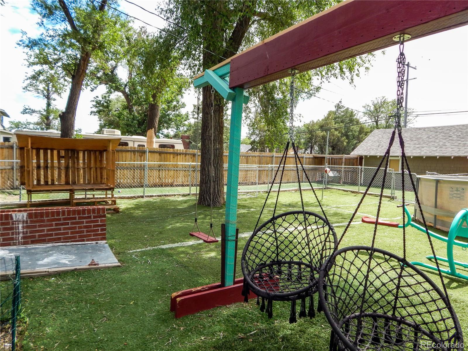 910 South Main Street Lamar, CO 81052 - Photo 37 of 37 a view of a chair and table in the yard