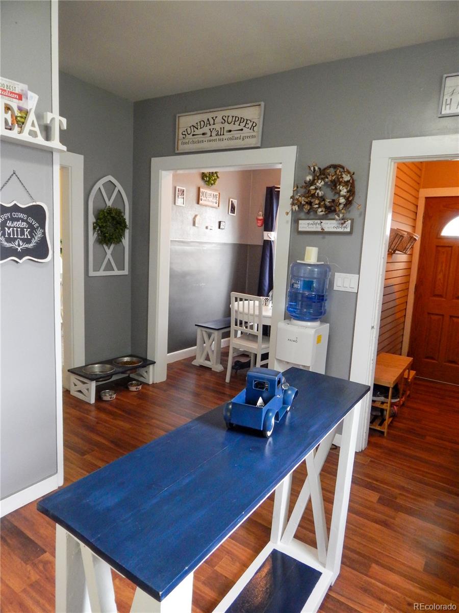 910 South Main Street Lamar, CO 81052 - Photo 6 of 37 a room with furniture and wooden floor