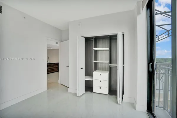 a view of a glass door with a balcony