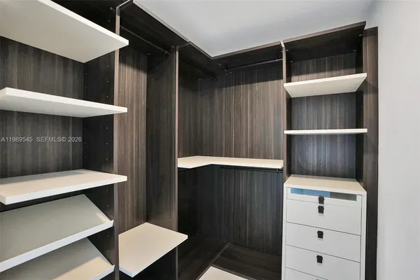 a bathroom with a sink toilet a mirror and shower