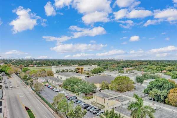 a view of a patio with couches and a fire pit