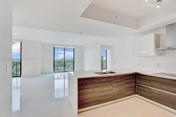 a view of kitchen with microwave and cabinets