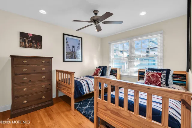 a bedroom with furniture and a window
