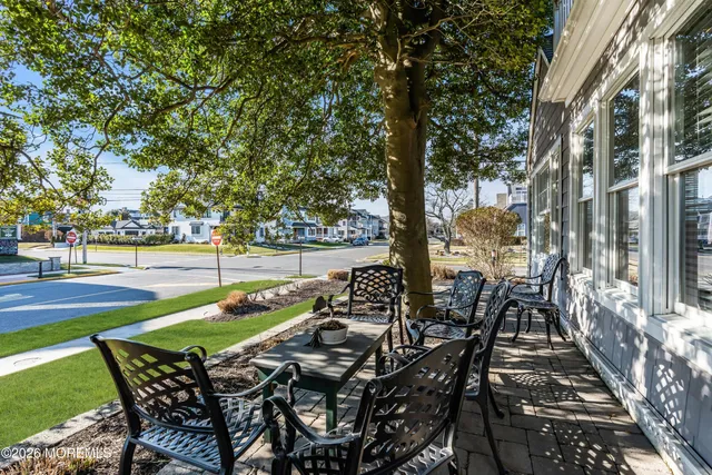 a view of a chairs and table on the patio