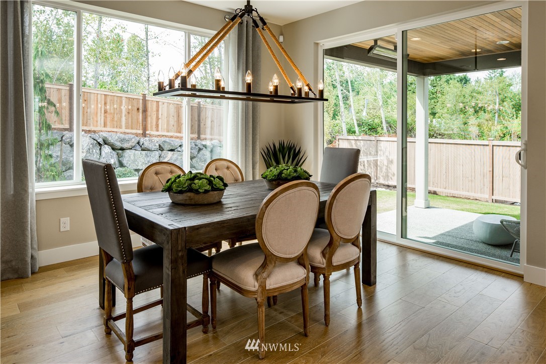 20 215th Street Southeast, Unit 12 Bothell, WA 98021 - Photo 11 of 22 a dining room with furniture window and wooden floor
