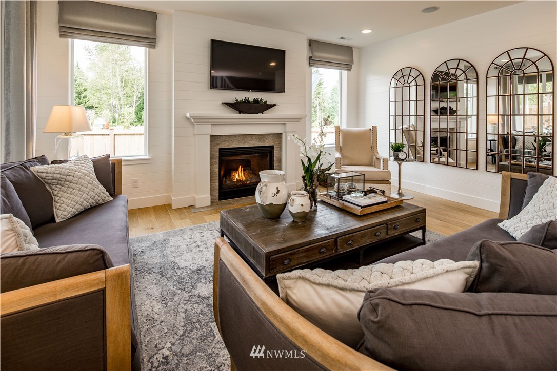 20 215th Street Southeast, Unit 12 Bothell, WA 98021 - Photo 12 of 22 a living room with furniture fireplace and flat screen tv
