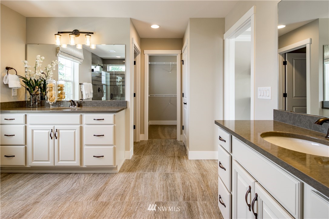 20 215th Street Southeast, Unit 12 Bothell, WA 98021 - Photo 15 of 22 a spacious bathroom with a granite countertop sink a toilet a mirror and shower