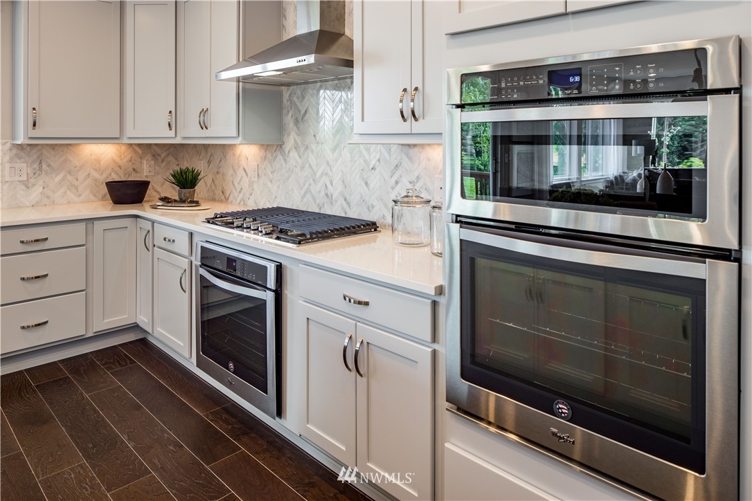 20 215th Street Southeast, Unit 12 Bothell, WA 98021 - Photo 9 of 22 a kitchen with cabinets and stainless steel appliances