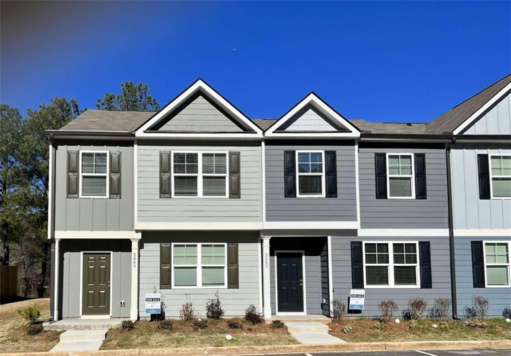 2860 Saratoga Lake View, Unit 17 Decatur, GA 30034 - Photo 1 of 1 a front view of a house with yard and glass windows