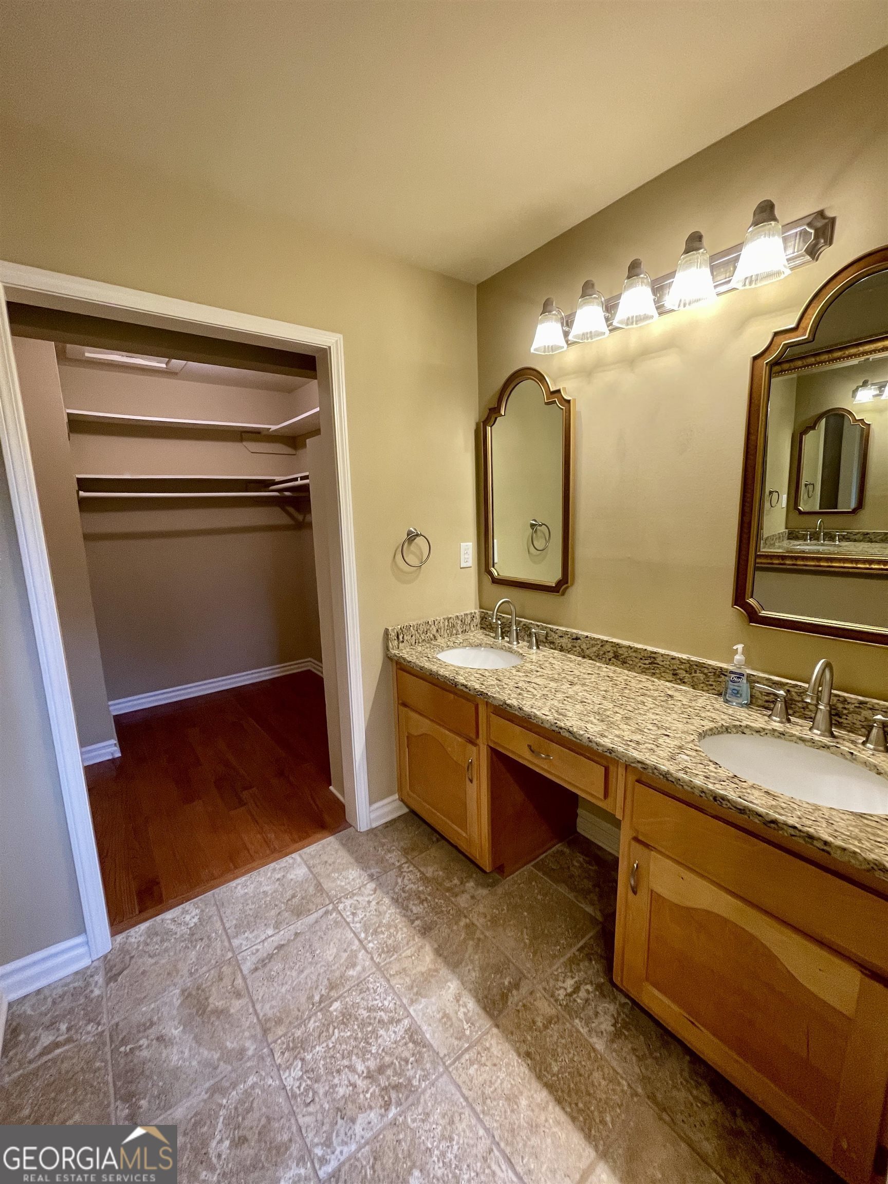 242 Ebenezer Church Road Fayetteville, GA 30215 - Photo 13 of 43 a bathroom with a sink and a mirror