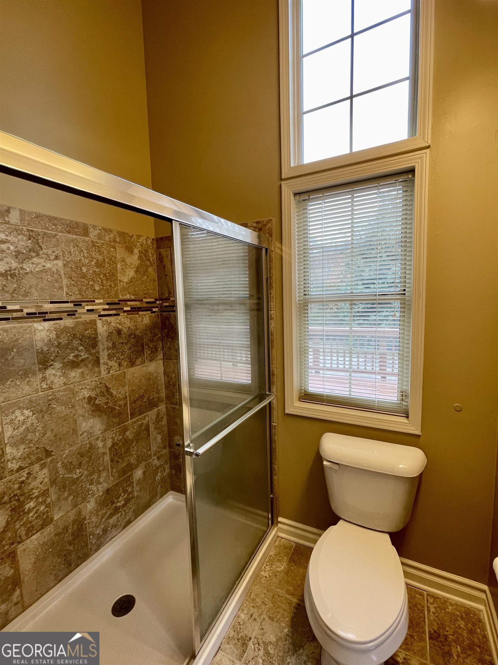 242 Ebenezer Church Road Fayetteville, GA 30215 - Photo 14 of 43 a bathroom with a toilet and a shower