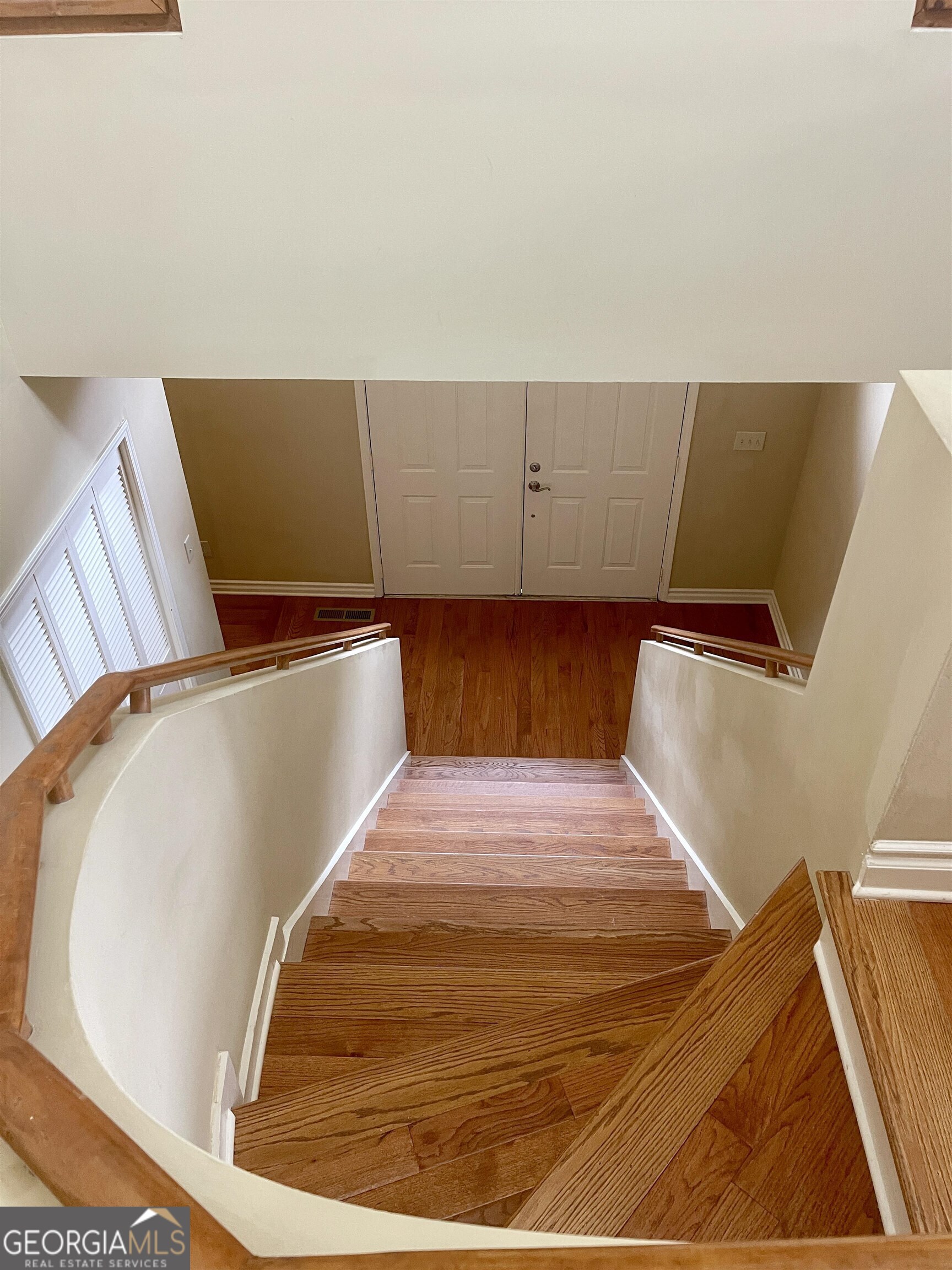 242 Ebenezer Church Road Fayetteville, GA 30215 - Photo 16 of 43 a bed sitting in a bedroom with wooden floor