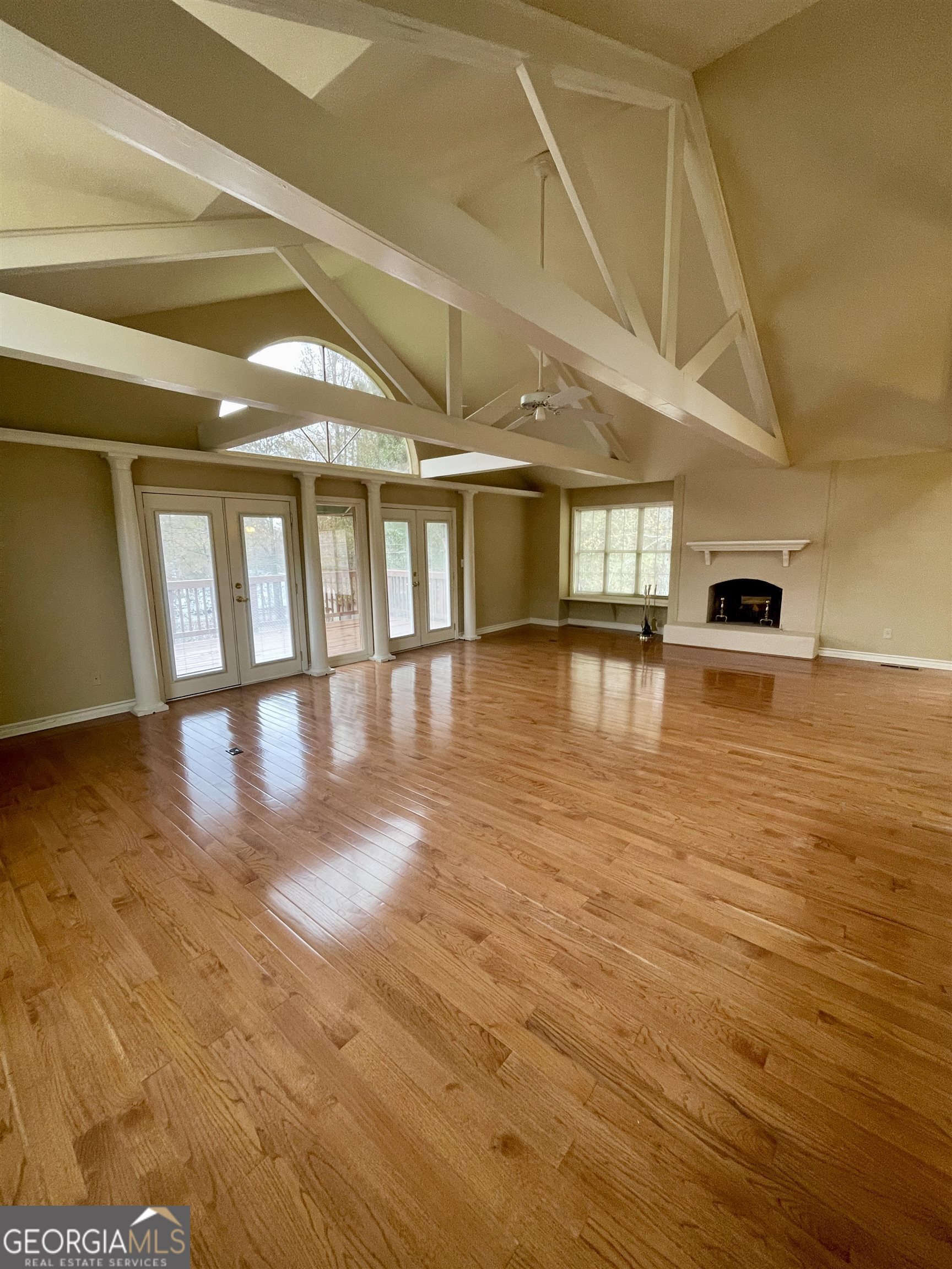 242 Ebenezer Church Road Fayetteville, GA 30215 - Photo 2 of 43 a view of an empty room with wooden floor