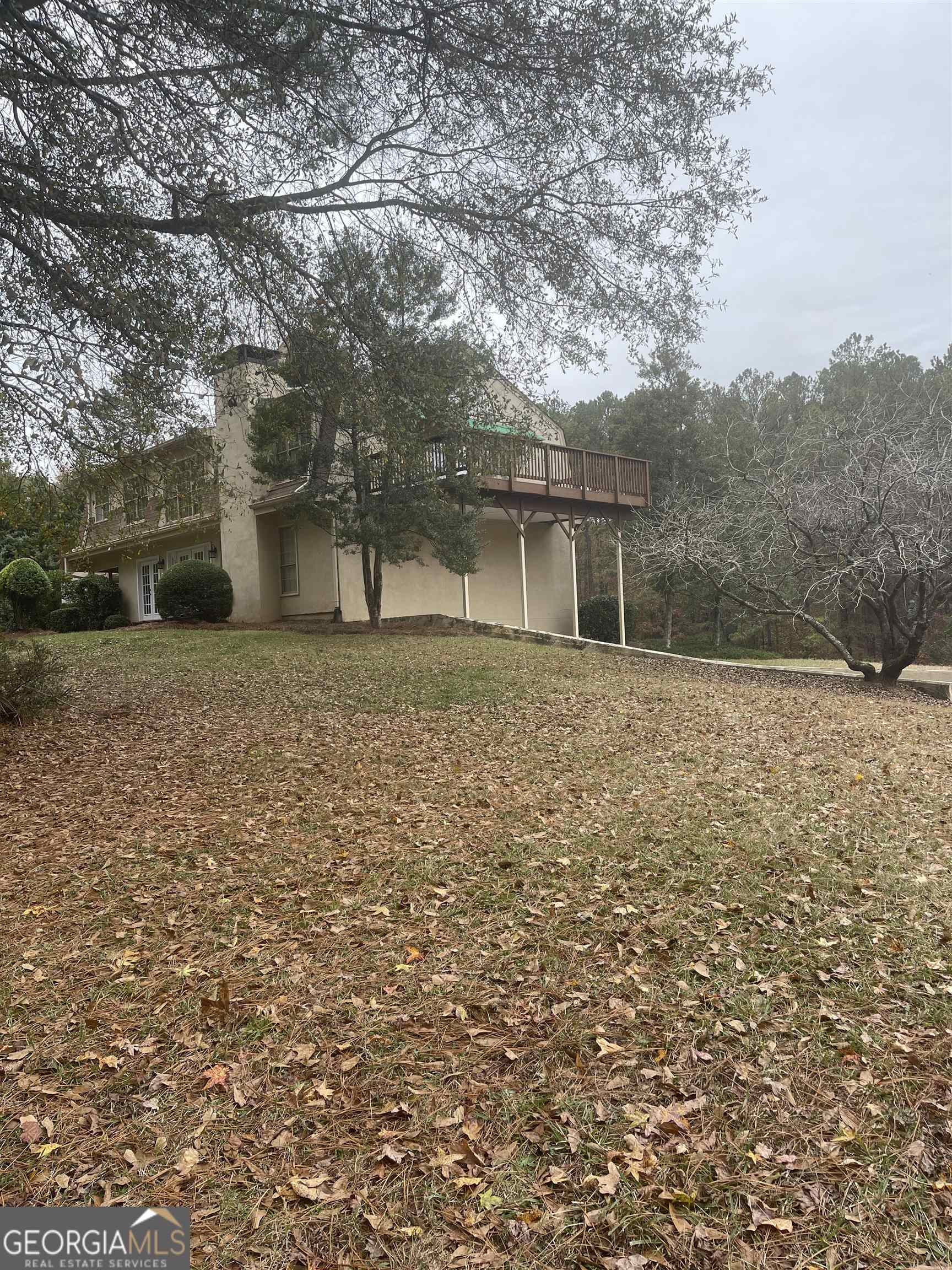 242 Ebenezer Church Road Fayetteville, GA 30215 - Photo 43 of 43 a front view of a house with a yard