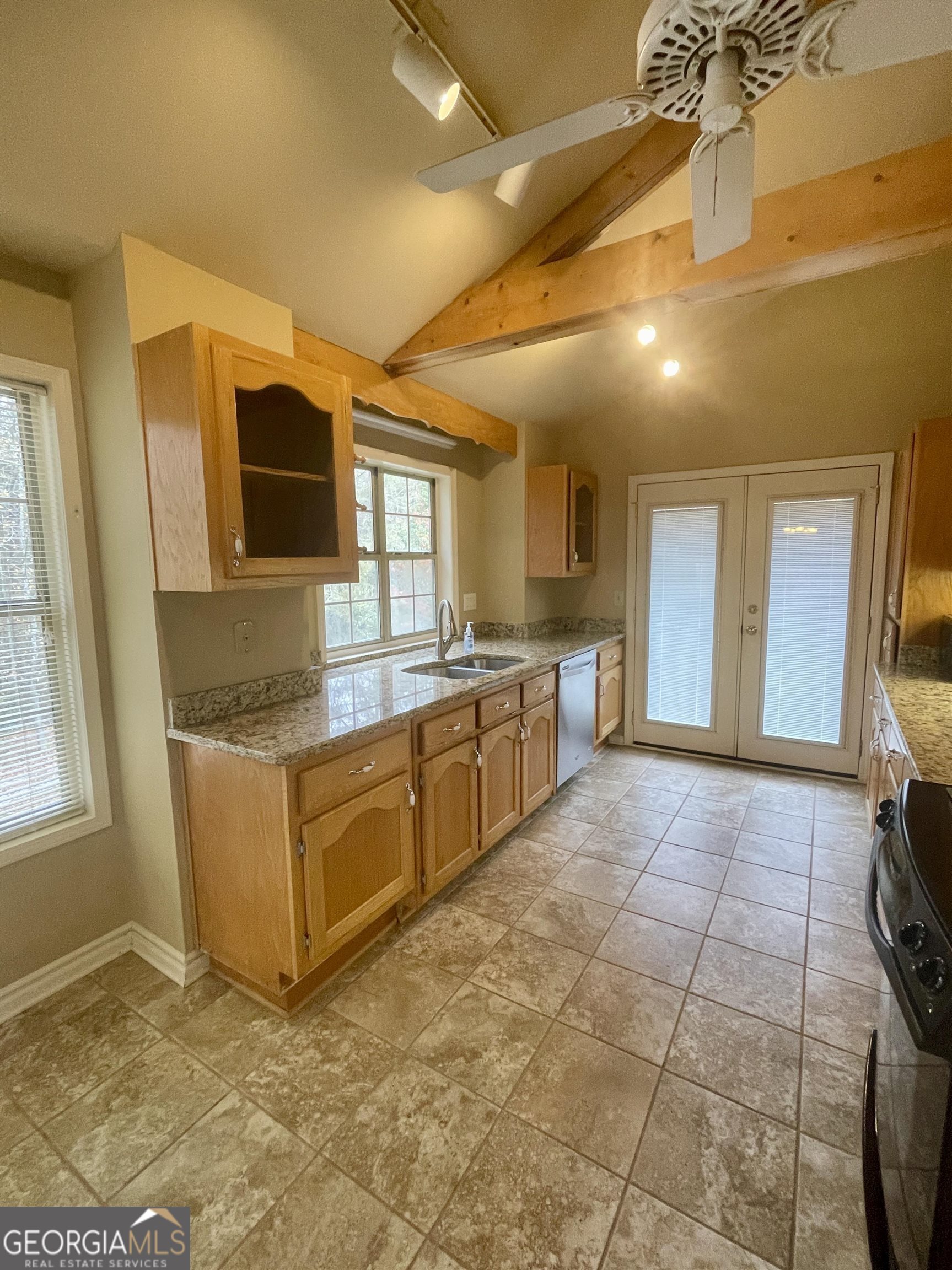 242 Ebenezer Church Road Fayetteville, GA 30215 - Photo 9 of 43 a large kitchen with cabinets and a sink