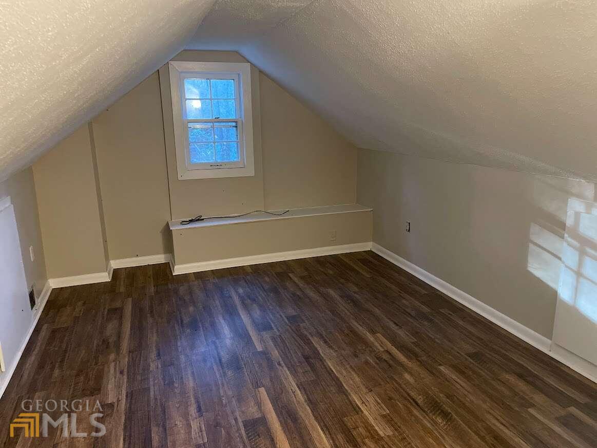 1939 Bonnie Ridge Drive Griffin, GA 30223 - Photo 18 of 23 a view of a room with wooden floors and led lights