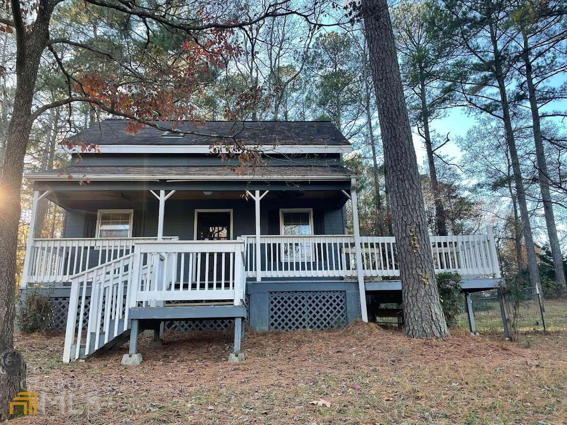 1939 Bonnie Ridge Drive Griffin, GA 30223 - Photo 2 of 23 a view of a house with a deck and a yard