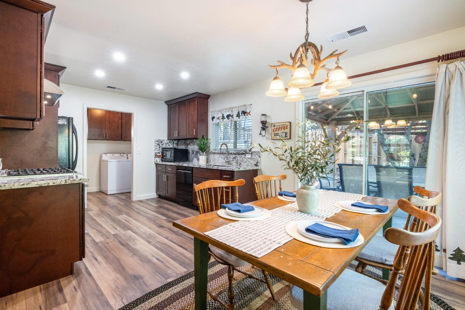 39398 Robin Bass Lake, CA 93604 - Photo 9 of 31 a view of a dining room with furniture a chandelier and wooden floor