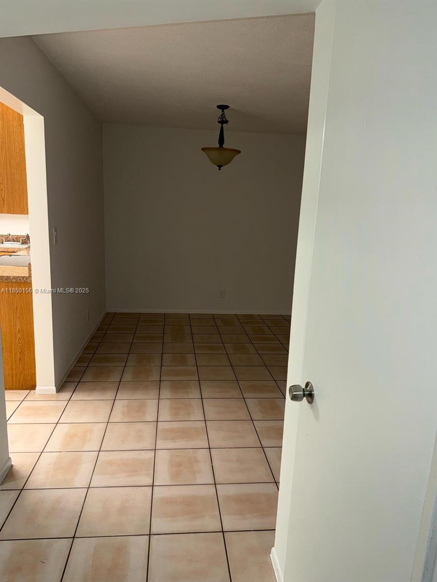 9203 Northwest 38th Drive, Unit 12 Coral Springs, FL 33065 - Photo 7 of 19 a view of a storage & utility room