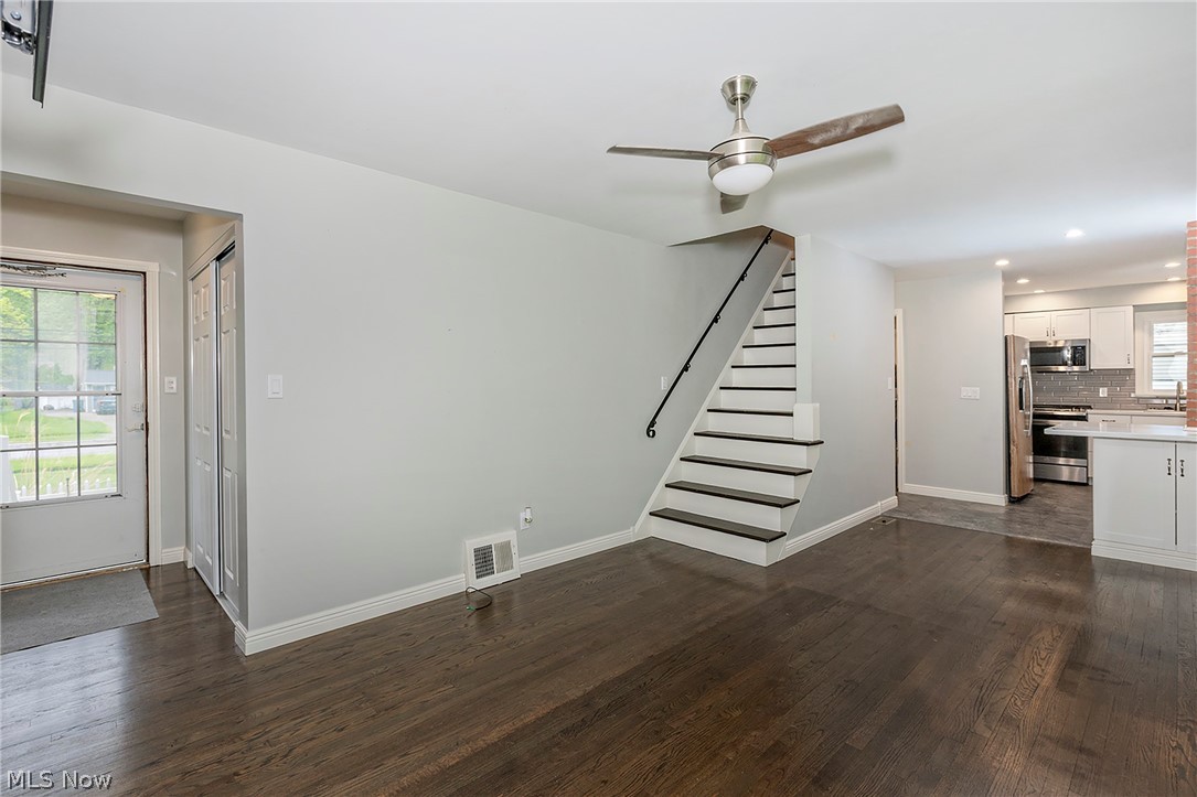 3719 Walter Road North Olmsted, OH 44070 - Photo 5 of 35 Open concept living space featuring dark wood-finish flooring and light gray wall tones