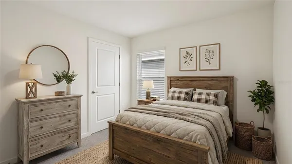 a bedroom with a bed and a dresser