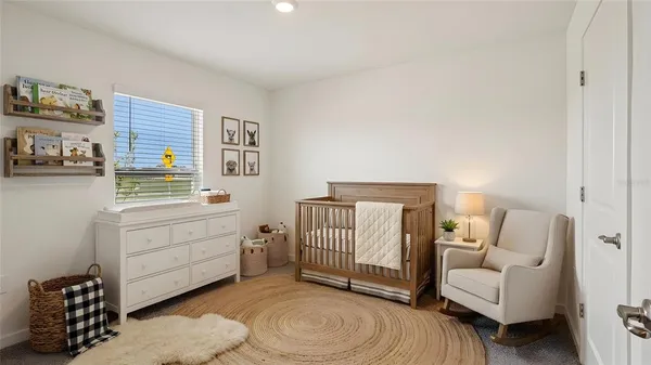 a bedroom with a bed and a couch