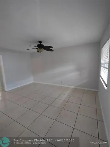 a view of a room that has a window in it