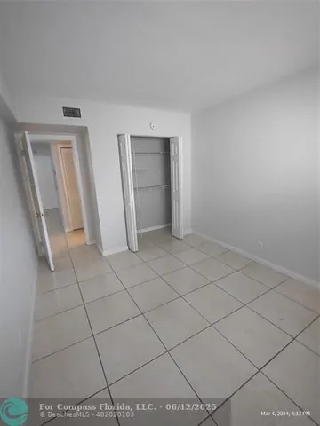 a view of an empty room and utility room